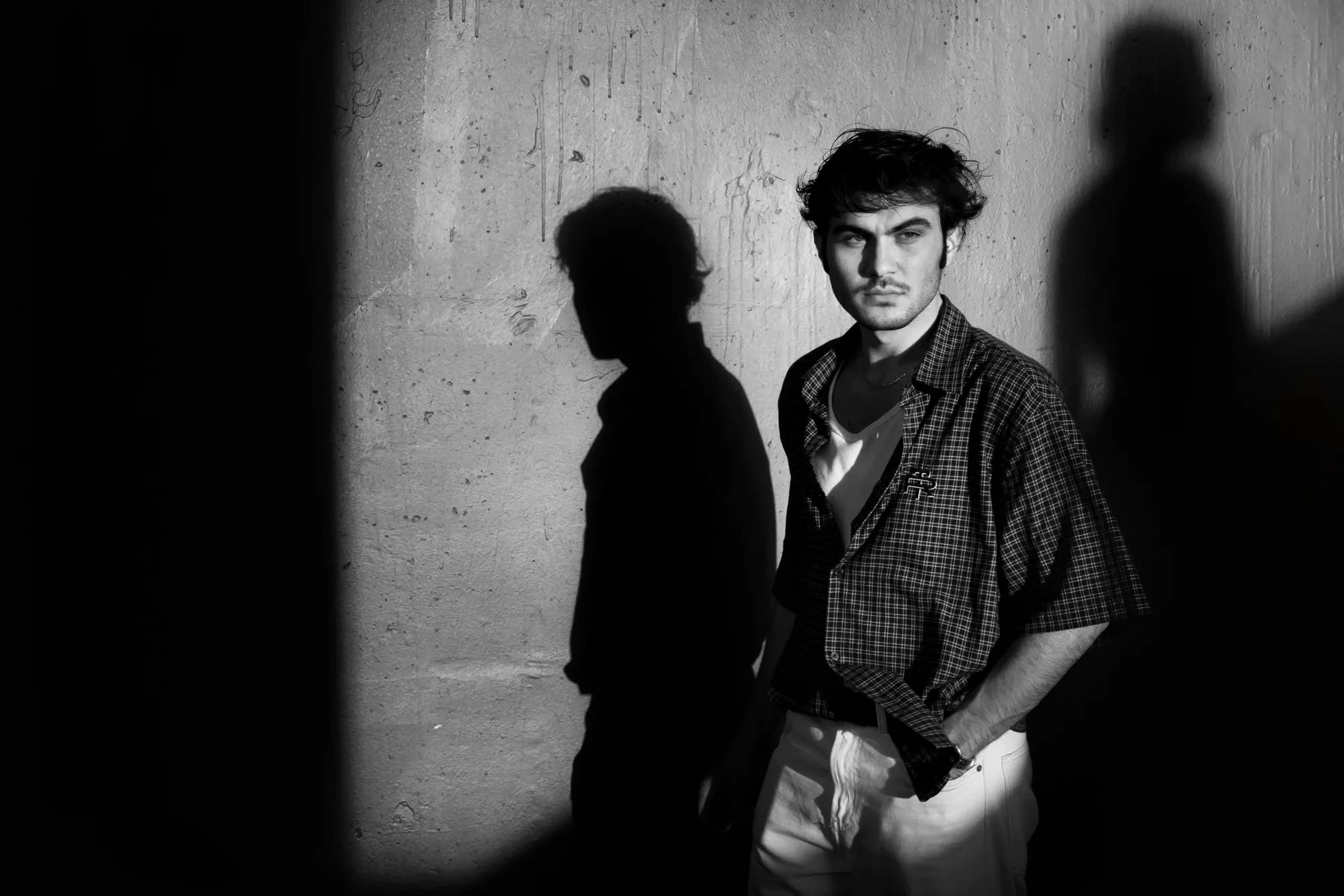 Black-and-white portrait of a man in directional light